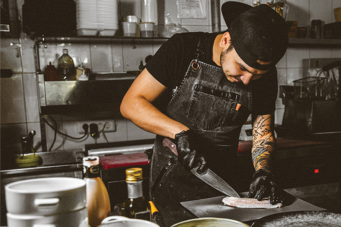A chef slicing fish