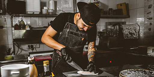 A chef slicing fish