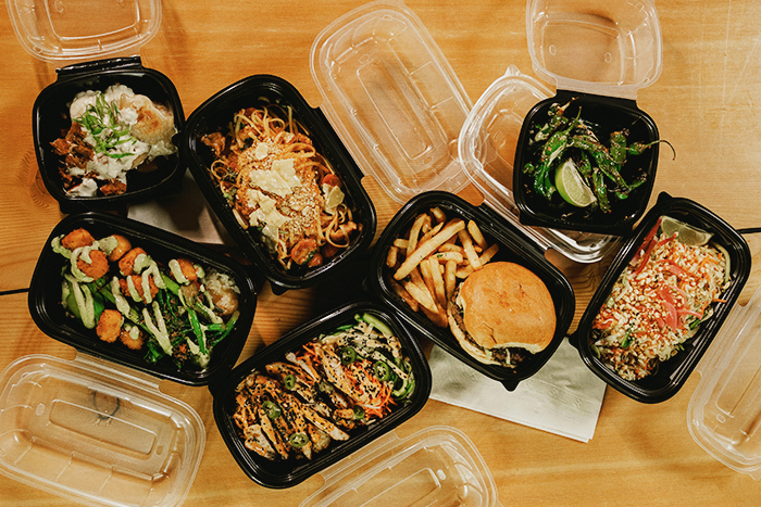 Arrangement of seven take-out meals being prepared for delivery from Edmonton’s Central Hall Social.