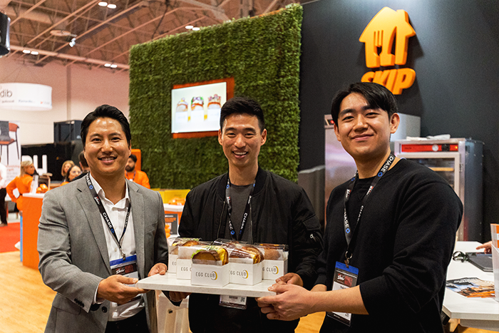 Egg Club co-founders, Jason, Tim and Jun, showcasing their delicious egg sandwiches on day 3 of the 2023 RC Show, in Skip’s booth.